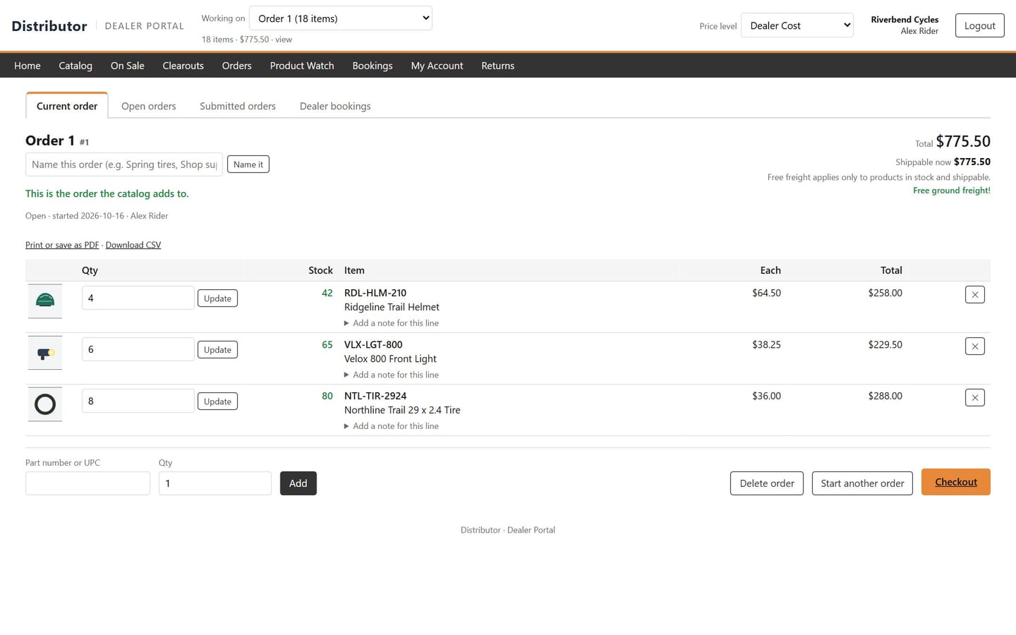 A bike shop's current order in the dealer portal, with stock for each line and the total